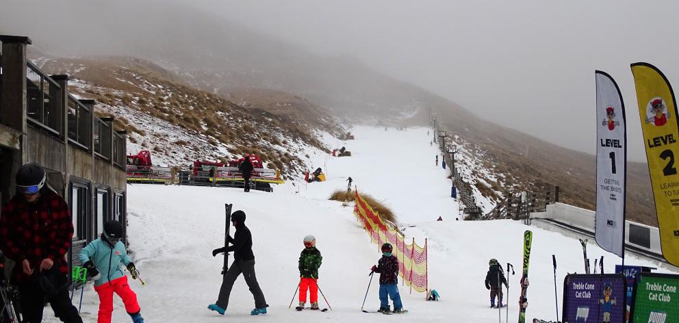 After weeks of delays, Treble Cone skifield finally had its open day yesterday, and while the conditions may not have been the best, about 1000 skiers and snowboards headed up the mountain. Photo: Kerrie Waterworth