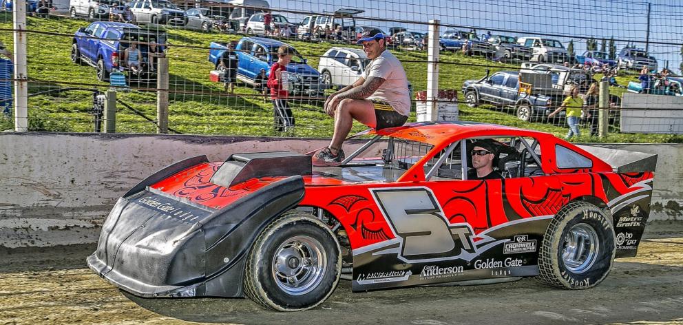 The late Daryl Ainsley on top of his super saloon during a pre-race parade of cars at a 2015...