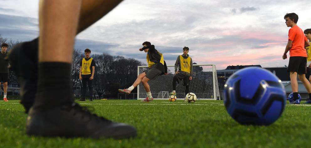 The Roslyn youth team trains at the artificial turf at Logan Park yesterday evening. PHOTO:...