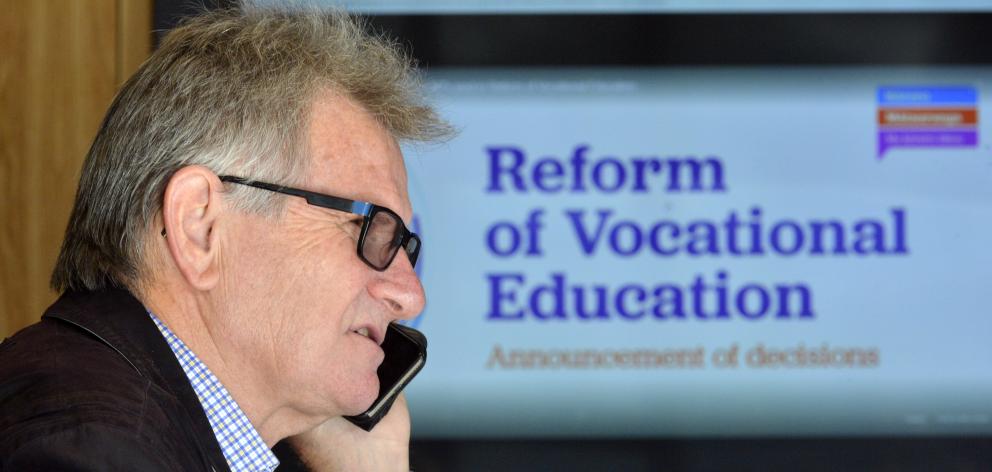 Otago Polytechnic chief executive Phil Ker takes a phone call after learning details of the...