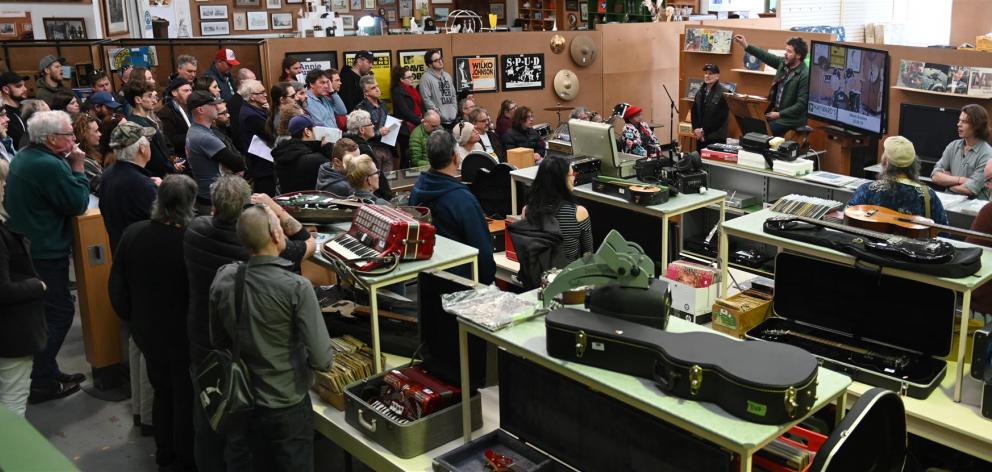 The steady tones of auctioneer John More help to empty shelves filled with musical memorabilia....