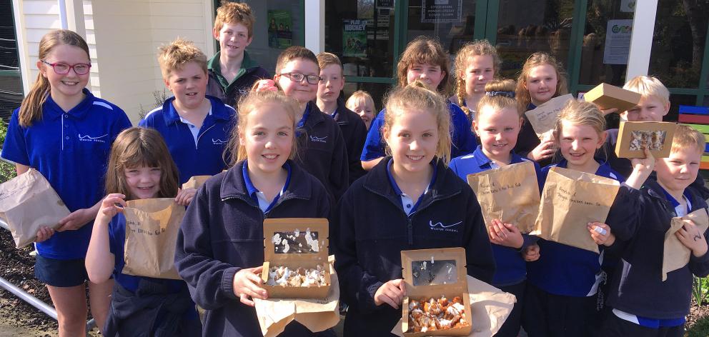 Weston School pupils with their lunches from Oamaru restaurant Midori, which now arrive in...
