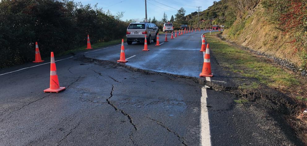 As a result the road was reduced to single-lane traffic at the slip point, with stop-go procedures in place to keep the road open. Photo: Supplied As a result the road was reduced to single-lane traffic at the slip point, with stop-go procedures in place to keep the road open. Photo: Supplied