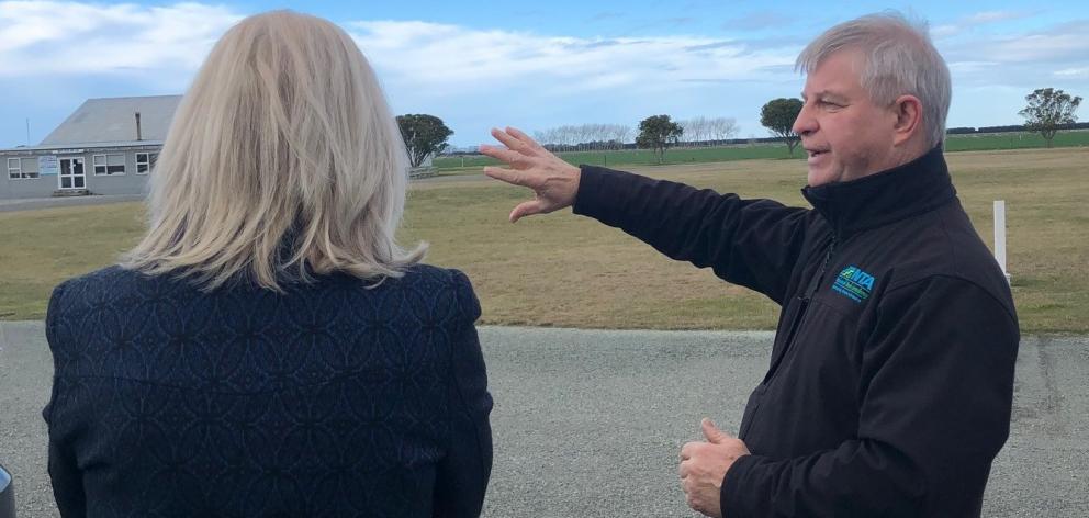 National Trade Academy managing director Craig Musson explains plans for a new dairy farm school at Oamaru Airport to Waitaki MP Jacqui Dean. Photo: Supplied