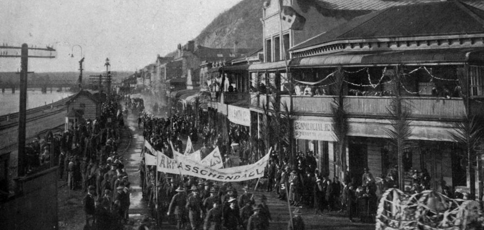 The peace procession in Greymouth passes along Mawhera Quay. - Otago Witness, 6.8.1919.