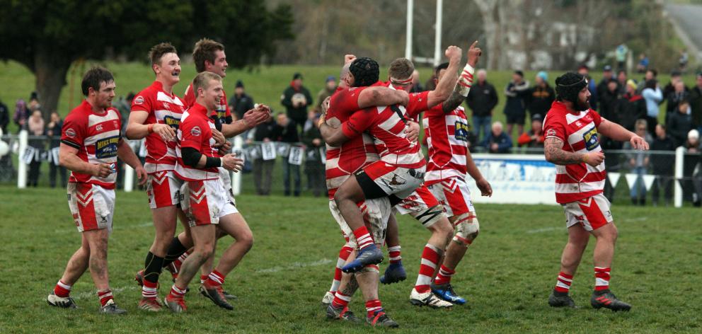 Clutha players celebrate at the final whistle of the Southern regional final at the Balclutha...