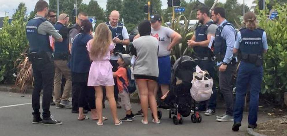 The infamous travellers talk to Police and Immigration officers in Hamilton. Photo: NZ Herald The infamous travellers talk to Police and Immigration officers in Hamilton. Photo: NZ Herald