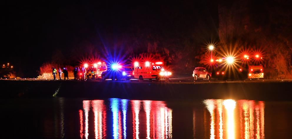 A marine and land search is conducted in Turnbulls Bay yesterday after the driver of a crashed car swam into the darkness.