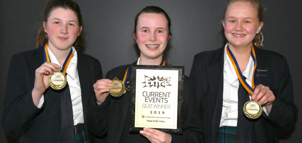 Otago Girls' High School pupils (from left) Chloe Alexander (14), Emily Gray (14) and Bella Bates (15) display their Otago Daily Times Extra! current events quiz medals. Photos: Linda Robertson