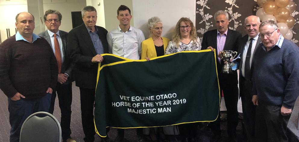 Awards officials are joined by supporters of Majestic Man, who was crowned Otago horse of the...