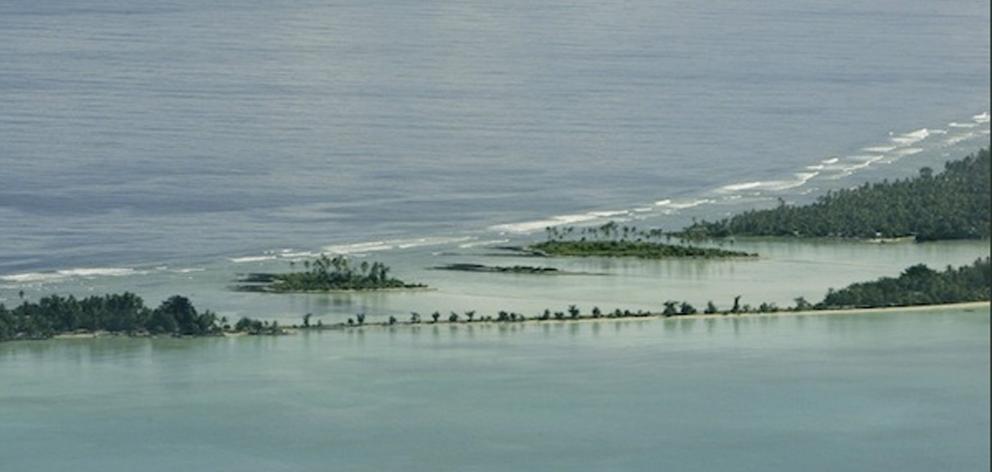 People living in low-lying Kiribati (pictured), Tuvalu and the Marshall Islands are among the...