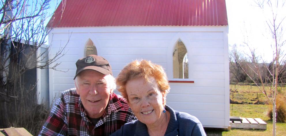 Mike and Rosemary Riddell in front of the tiny chapel on their Oturehua property. The couple are...