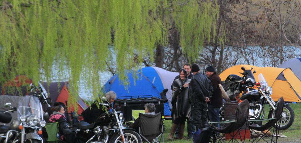 Under the trees at Parsons Rock, about 700 motorcycle riders sort out their campsites late on...