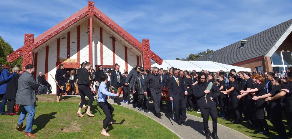 A haka and waiata are performed as a procession carrying former Ngai Tahu chief executive Tahu...