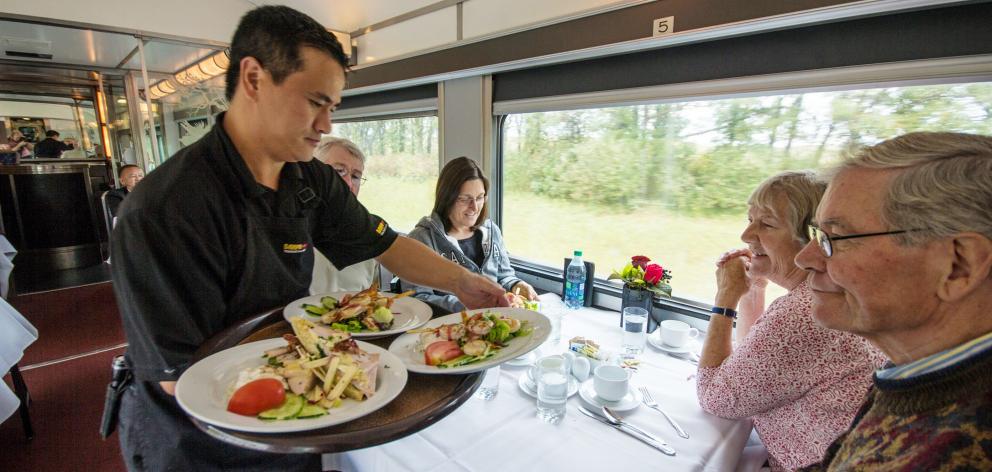 Food being served in the dining car. 

