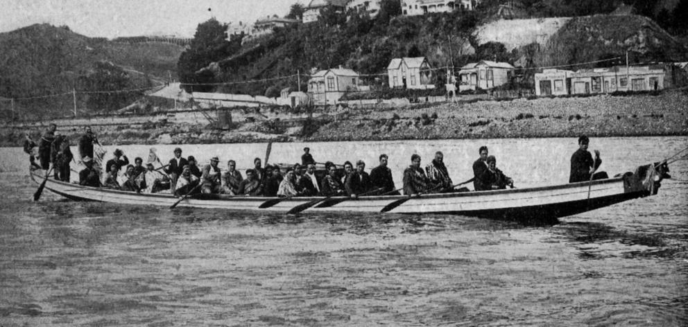 A Maori war canoe that greeted the Wanganui Harbour Board’s new dredge, Kaione, at the mouth of...