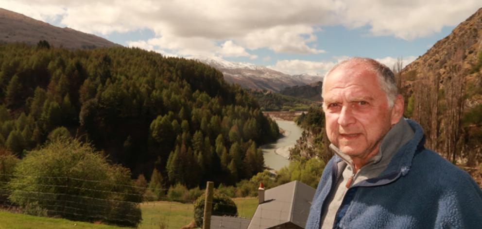 Concerned ratepayer Tom Dery opposite a proposed hillside subdivision above the Shotover River. Photo: Mountain Scene