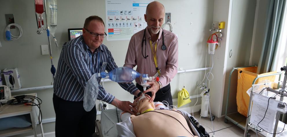 Dr Alex Feberwee and Dr Steve Withington check "vital signs'' on the model.