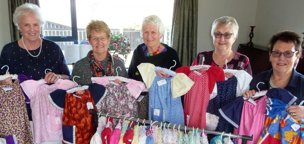 With the 30 dresses are Ashburton Inner Wheel dress makers Judy Kingsbury, Rosemary Moore,...