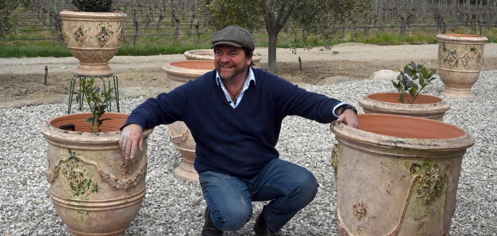 Yannick Fourbet with some of his French-made pots with their antique glaze outside his Lowburn workshop. Photos: Craig Baxter