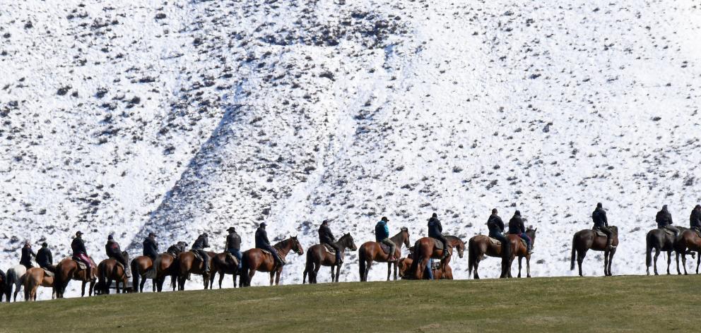 Riders line a ridge near the film set in the Ahuriri Valley. Photo: Stephen Jaquiery