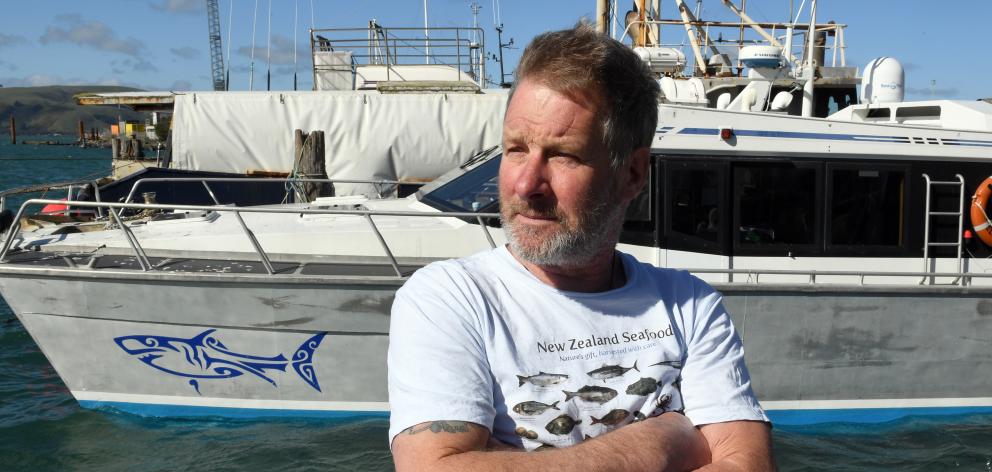 Backed by his shark cage diving vessel Fierce Elegance at Careys Bay yesterday, Shark Dive NZ...