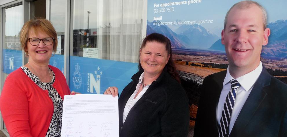 Ashburton College teacher aide Cezarne Rodgers hands over the open letter to Rangitata electorate...