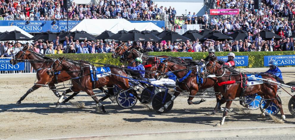 Cruz Bromac and driver Blair Orange beat Spankem and Mark Purdon to win the New Zealand Cup yesterday. Photo: Race Images