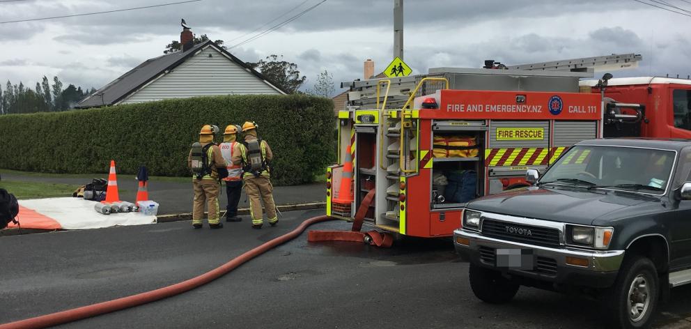 Emergency services at the scene of the fire at a house in Ashmore St. Photo: Emma Perry