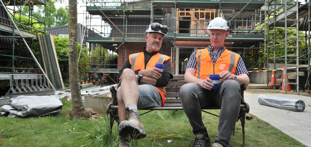 A quick break for Logic Group construction manager Neville Bray (left) and project manager Andrew Voss. Photo: Christine O'Connor