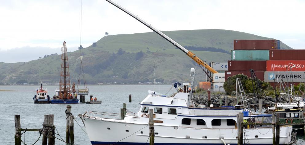 A 250-tonne Titan crane lowers the first section of a new fishing jetty into position at Boiler Point, Port Chalmers, yesterday. Photo: Gerard O'Brien