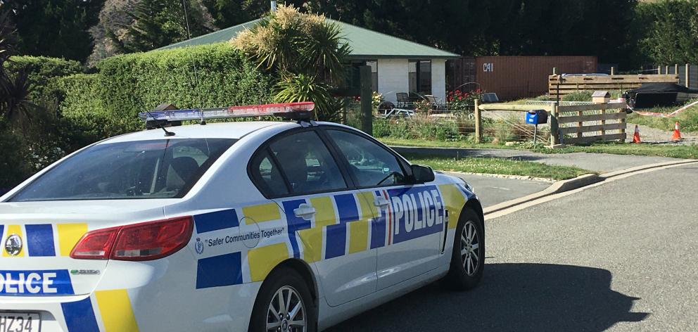 A police car at the cordoned Freyberg Ave property in Kurow where a man was shot dead by police...