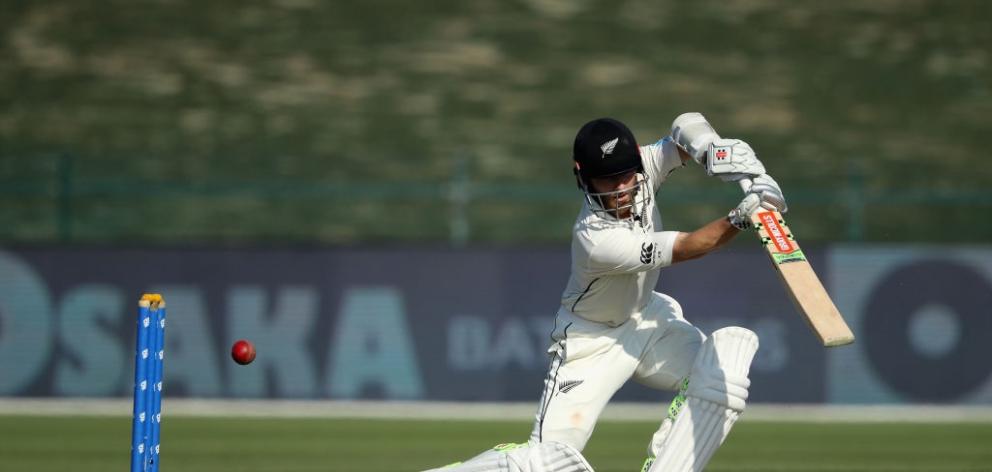 Kane Williamson plays a shot through the covers on the opening day of the third test against...