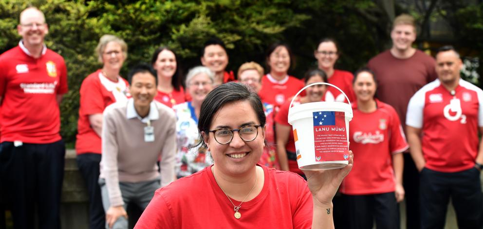 Southern District Health Board radiation therapist Sara Kokaua and her red-clad colleagues, who have raised hundreds of dollars for the Unicef Samoa measles emergency fund. Photo: Peter McIntosh