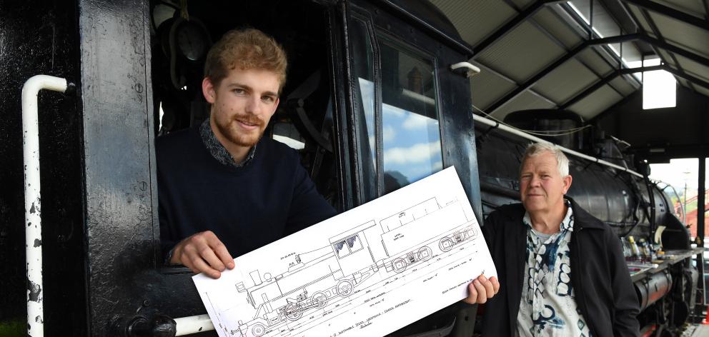 Sam Mackwell (left) and Nico Haima, of Christchurch firm Mackwell Locomotive Ltd, with plans for a wood-powered steam locomotive they hope will see machines like JA 1274, now based at Toitu Otago Settlers Museum, return to the rails. Photo: Stephen Jaquie