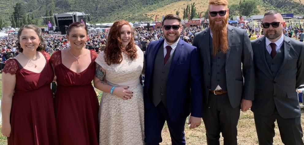 Newlyweds Rebecca and Alan Menzies are flanked by (from left) bridesmaids Amber Hosking and Jamie...