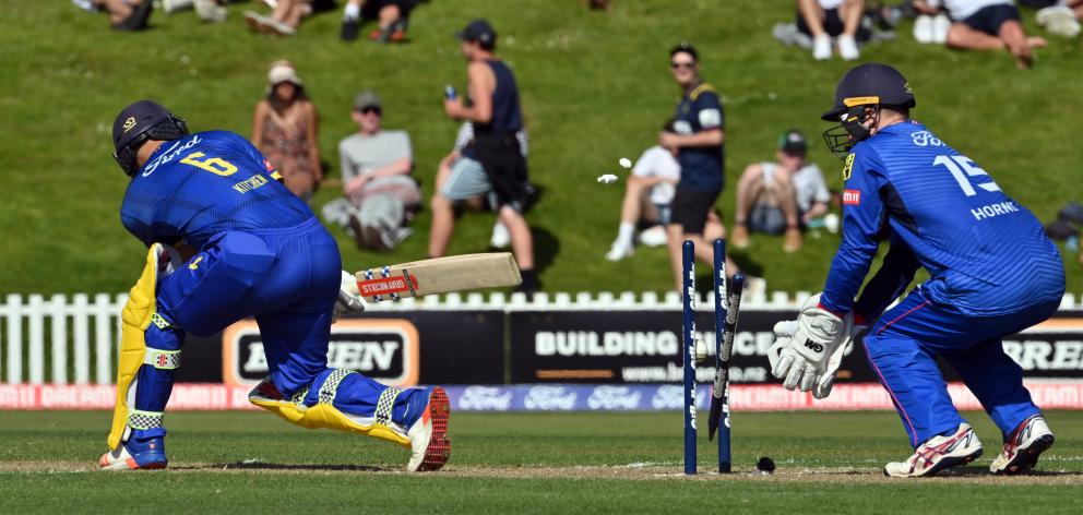 Volts batsman Anaru Kitchen is bowled by Mark Chapman for 21. The Aces wicketkeeper is Ben Horne. 