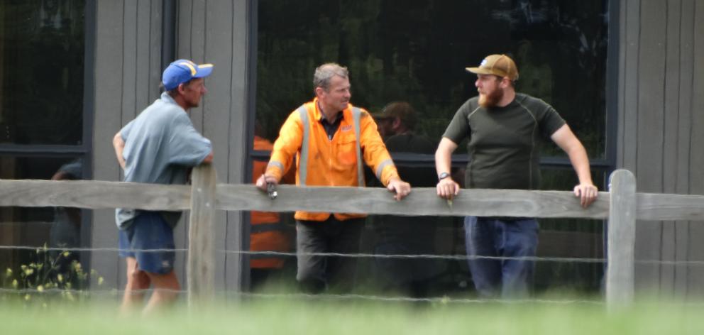 Wanaka Rugby Club president Richard Pledger, club member Danny Greig and groundsman Chris Rook talk turf. Photo: Mark Price