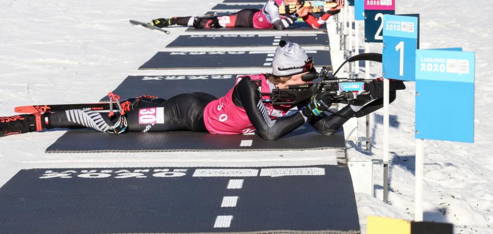 Campbell Wright, of Hawea Flat, shoots and skis in the men’s 7.5km sprint biathlon at the Youth Winter Olympics in Lausanne, France, yesterday. Wright finished fourth to go with his earlier sixth in the 12.5km event. Photos: Getty Images