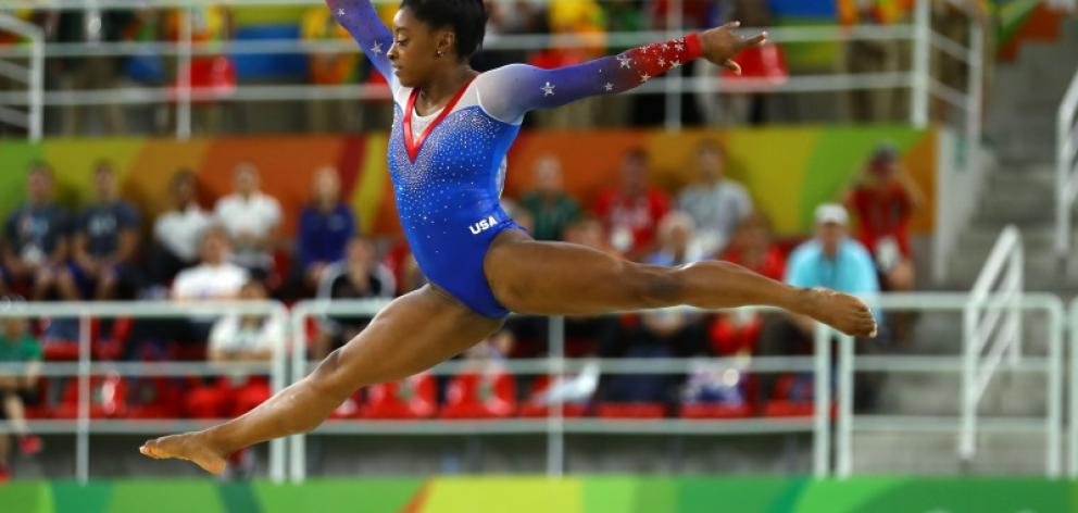 Simone Biles competes on the floor in the women's gymnastics. Photo: Reuters