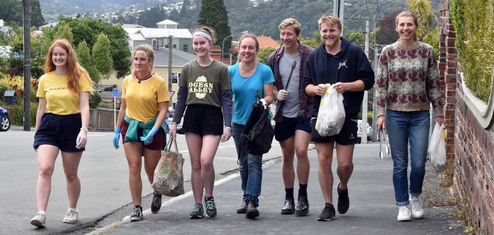 Removing rubbish from Dunedin streets, beginning in Royal Tce yesterday, are students (from left)...