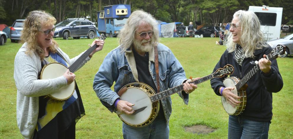 Enjoying a jam session on their banjos at the Whare Flat Folk Festival yesterday were (from left) Monica Barkman, Robbie Stevens and Carola Dunbar, all of Dunedin. Photos: Gerard O'Brien