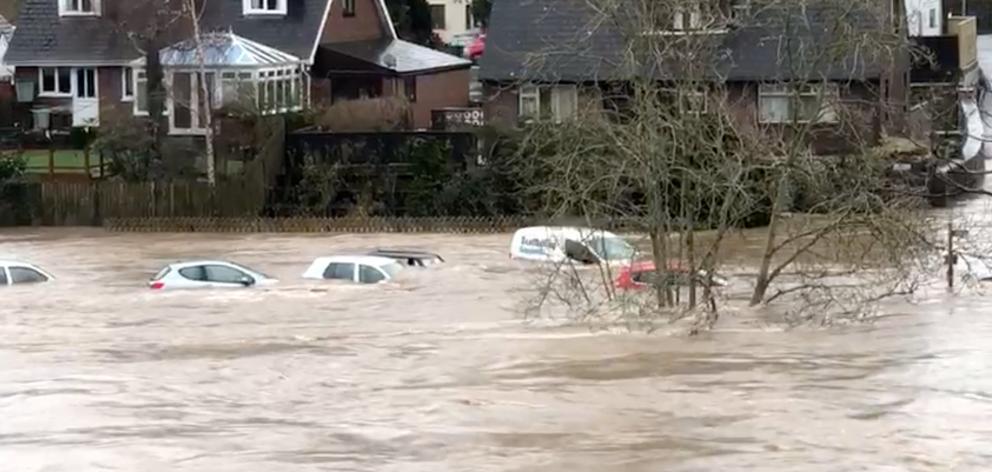 Cars were swept away by floodwaters after the River Wye broke its banks, in Hay-on-Wye, Wales....