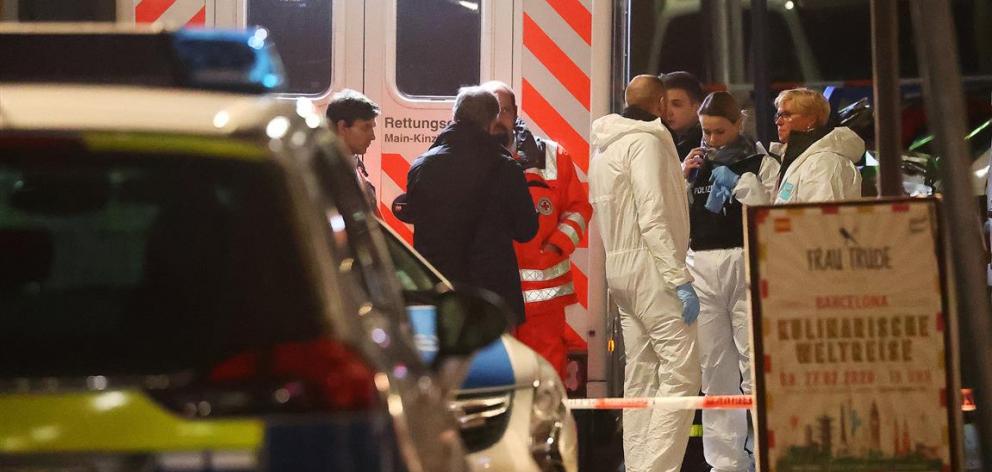 Forensic experts at work outside a shisha bar in Hanau following the shooting. Photo: Reuters