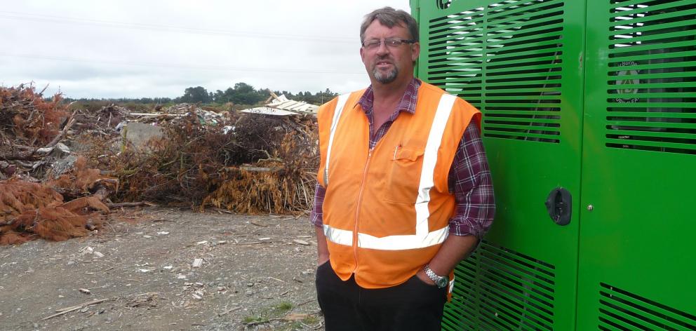 Greg Donaldson alongside his current biomass incinerator at the Ashburton Eco Park.