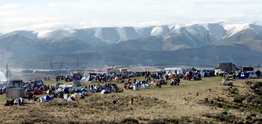 The snow-covered Hawkdun Range rises above the Brass Monkey Rally camp at Idaburn dam, near...