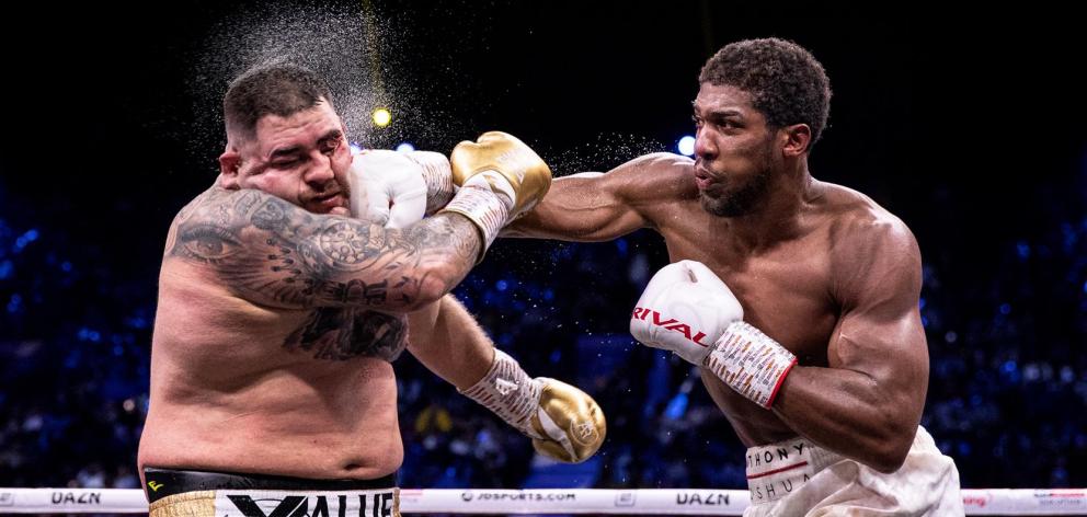 Anthony Joshua gets a right hand past the defences of Andy Ruiz jun during their heavyweight...