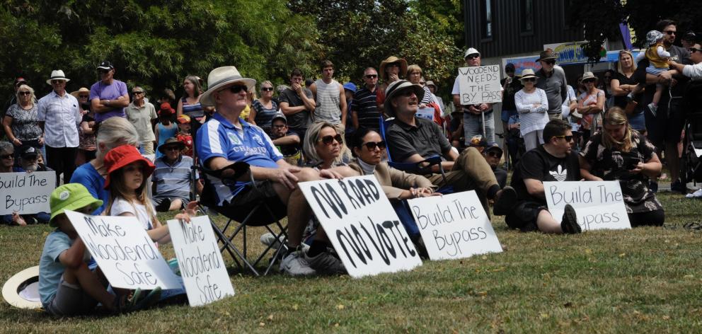 Residents listen to a series of speakers at the Rally for Woodend on the need for a bypass.