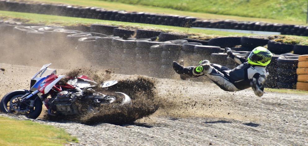 Heath Botica, of Nelson, parts company with his Ducati 696 during one of the sprint races held at...