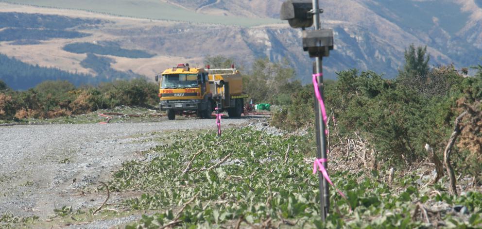 Instruments in the burn site measure fire activity, using drip line ignition.